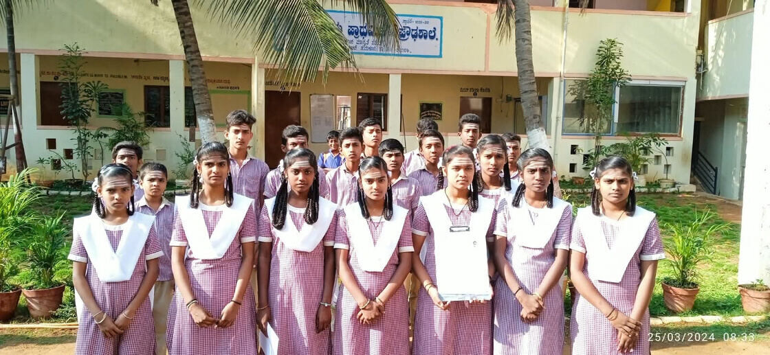 Students in school uniform standing outside the ashrama